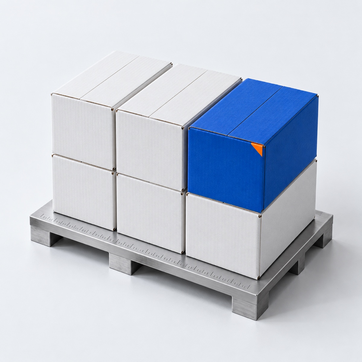 A studio study of white and cobalt shipping cartons on an aluminium platform